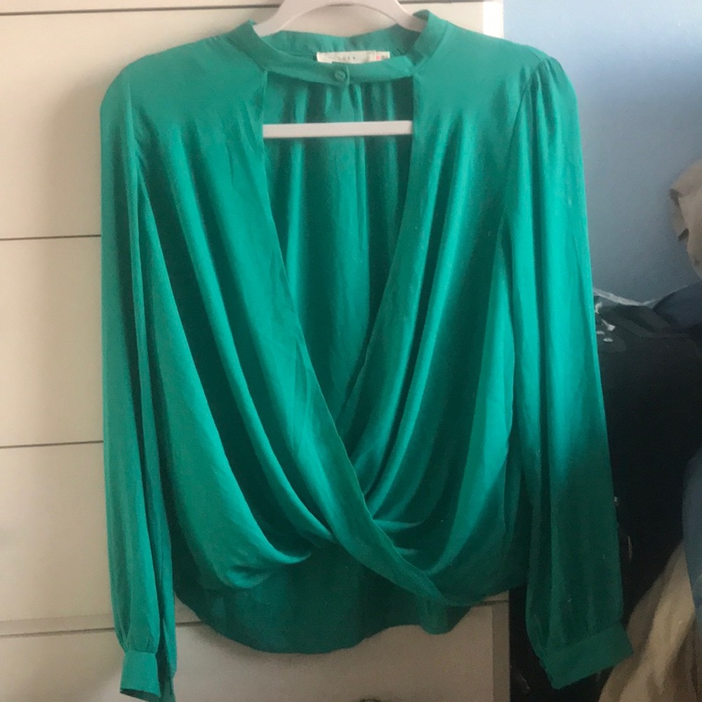 Long sleeved blouse with button collar detail